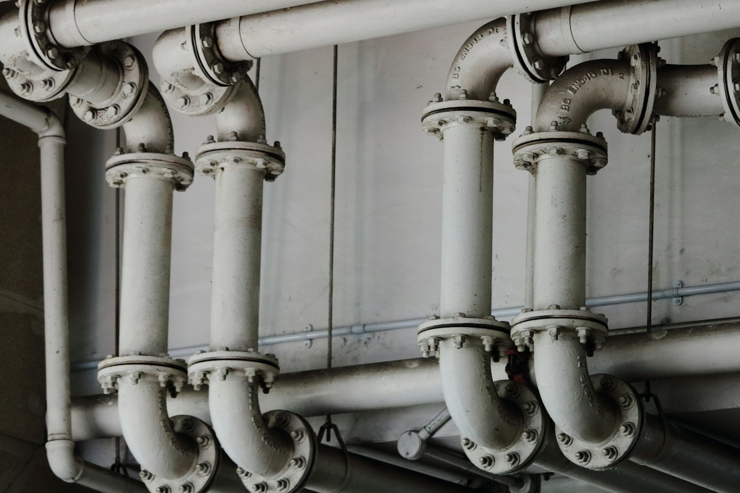 Aging metal water pipes — the most common source of lead in drinking water is corrosion of lead pipes, solder, and brass fixtures, not the water source itself.