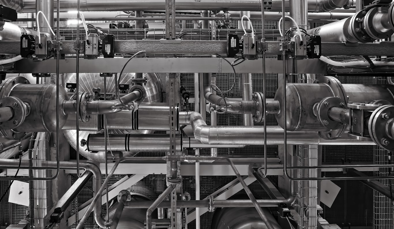 Industrial machinery and piping — volatile organic compounds in water typically originate from industrial processes, solvents, and fuels.